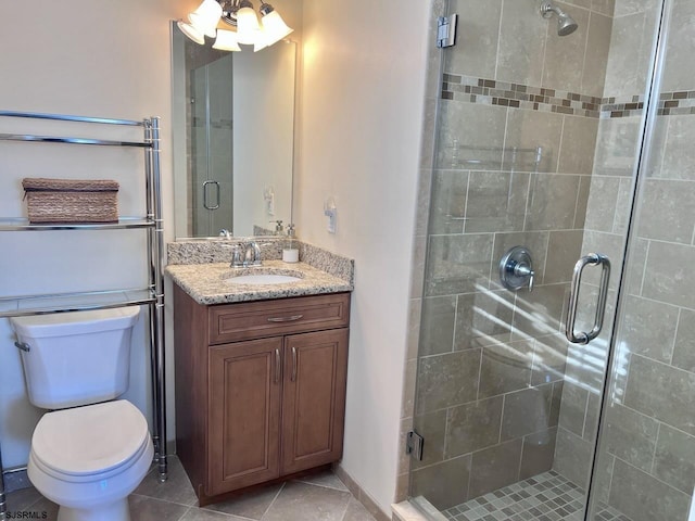 bathroom featuring walk in shower, tile patterned floors, vanity, and toilet