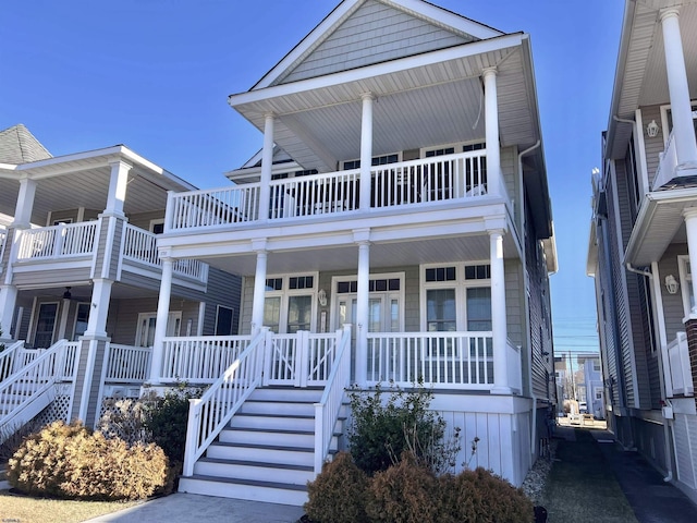 view of front facade featuring a balcony and a porch