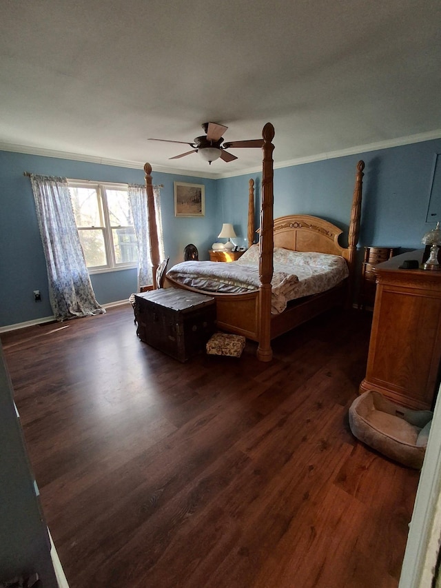 bedroom featuring ornamental molding, dark wood-type flooring, and ceiling fan