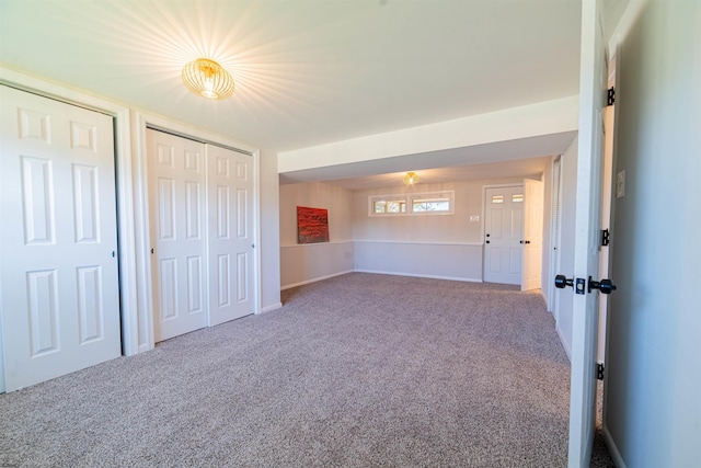 interior space featuring multiple closets and carpet