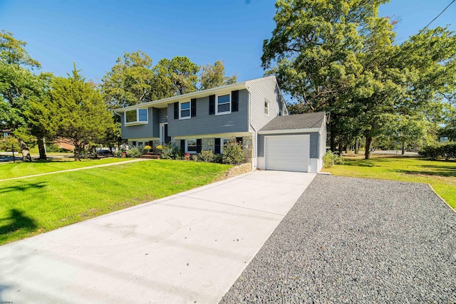 bi-level home featuring a garage and a front lawn