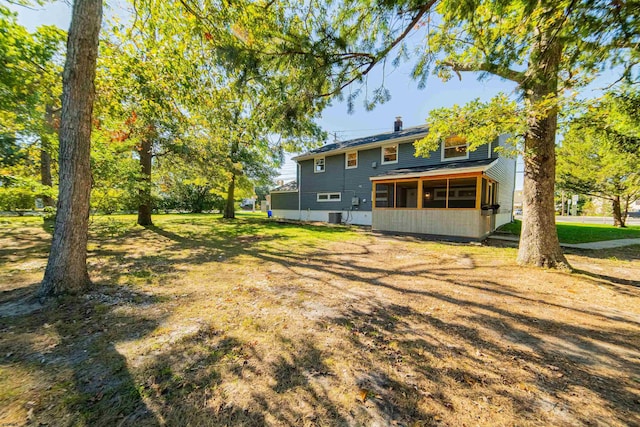 view of yard with a sunroom