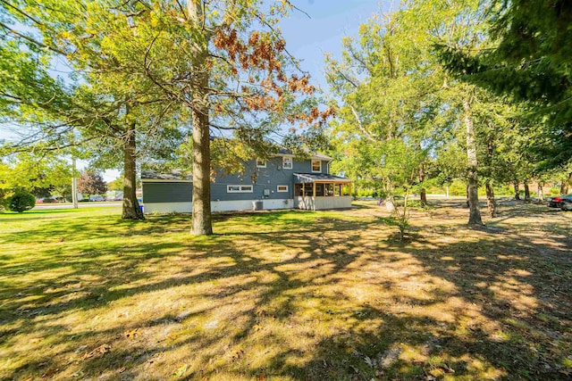 view of yard with a sunroom