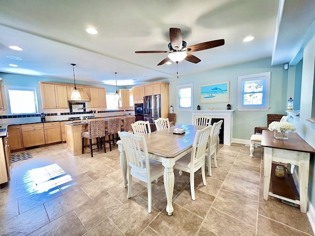 dining room featuring ceiling fan