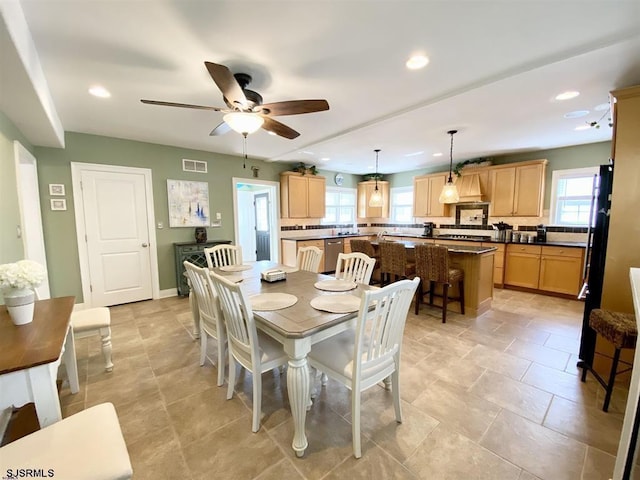 dining space featuring ceiling fan