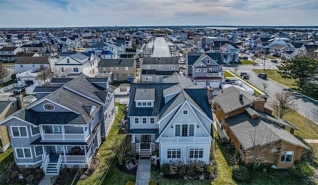 birds eye view of property with a residential view