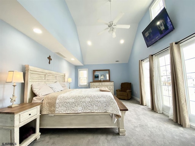 bedroom with ceiling fan, high vaulted ceiling, and light carpet