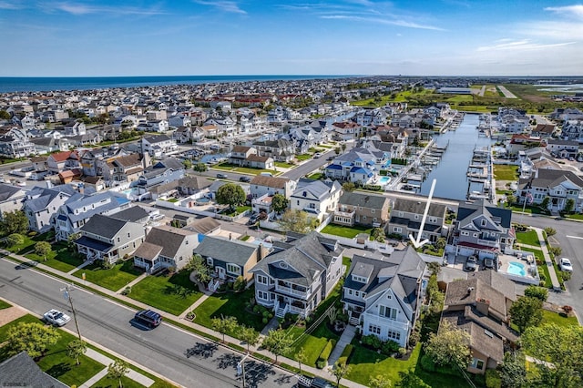 bird's eye view featuring a residential view and a water view