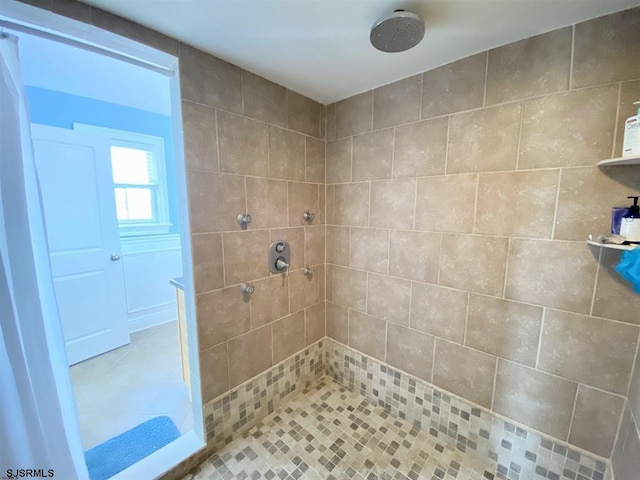 bathroom with a tile shower