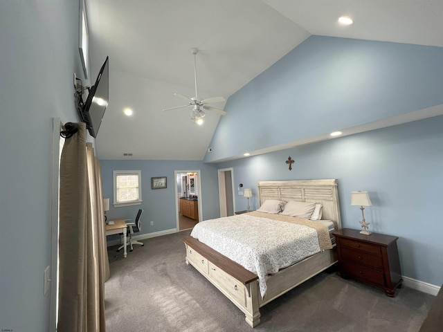 carpeted bedroom featuring ceiling fan, high vaulted ceiling, and ensuite bath