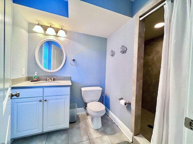 bathroom with a shower with curtain, vanity, toilet, and tile patterned flooring