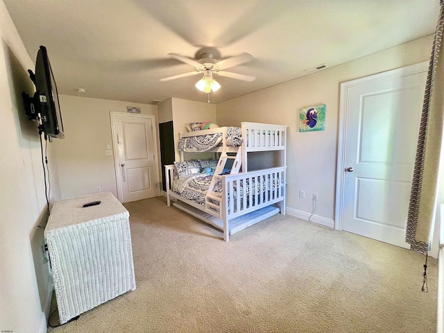 bedroom with light carpet and ceiling fan