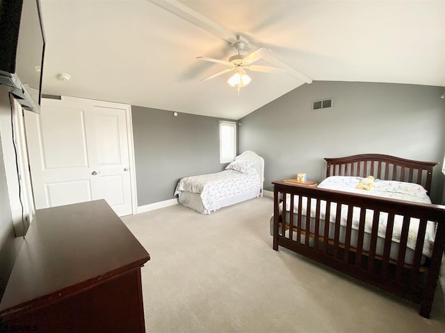 carpeted bedroom featuring lofted ceiling with beams and ceiling fan