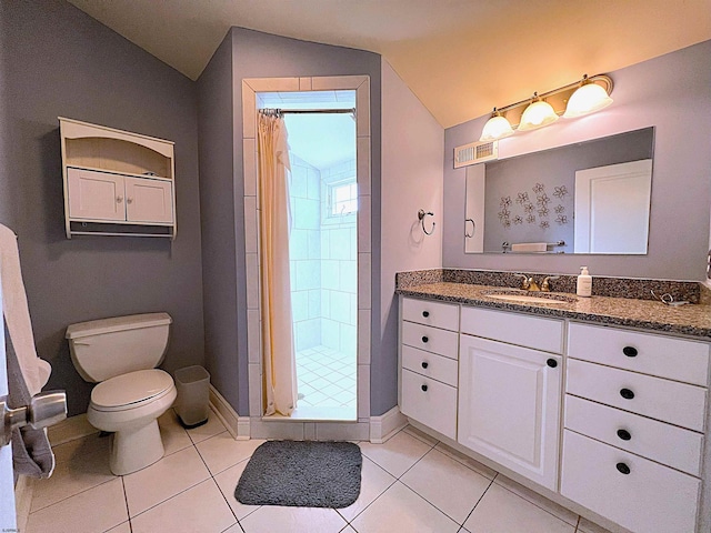 bathroom featuring walk in shower, lofted ceiling, toilet, tile patterned floors, and vanity