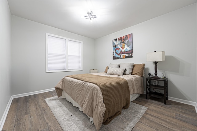 bedroom featuring dark hardwood / wood-style flooring