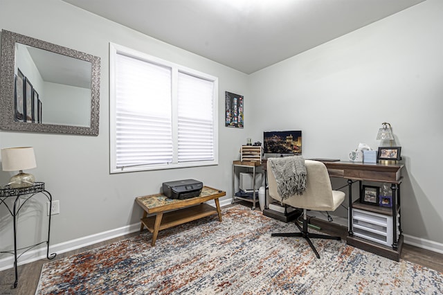 office space with wood-type flooring