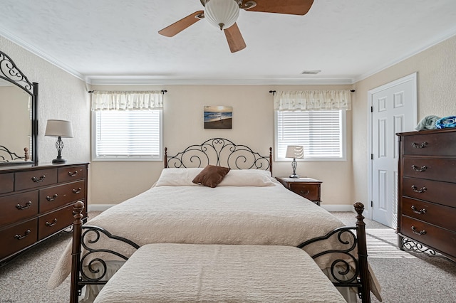 bedroom with crown molding, light colored carpet, and ceiling fan