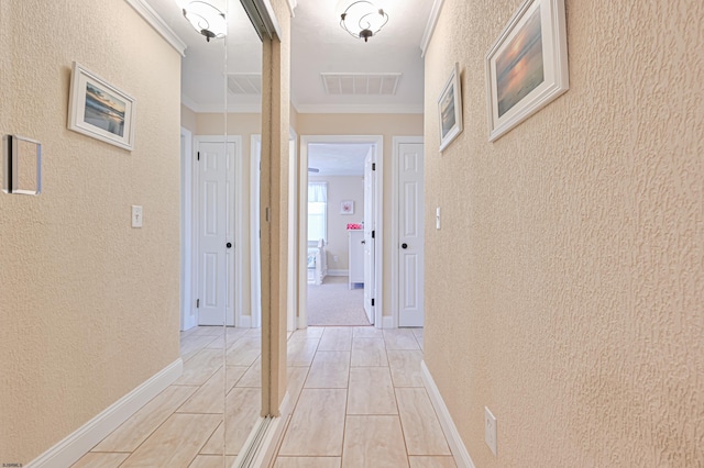 hall featuring ornamental molding