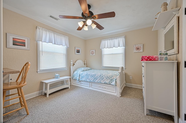 bedroom featuring crown molding, light carpet, and ceiling fan