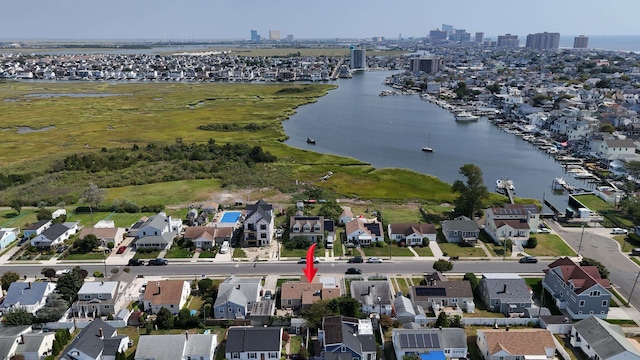 birds eye view of property with a water view