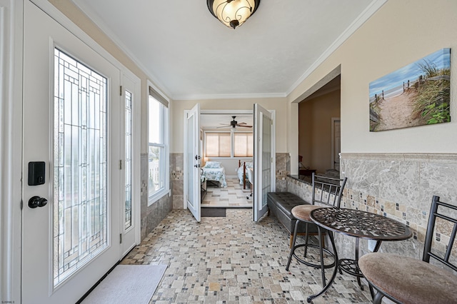 entrance foyer featuring ornamental molding