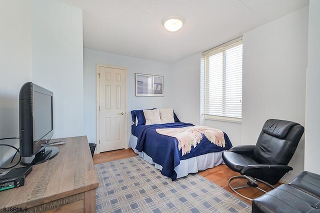 bedroom with light hardwood / wood-style floors