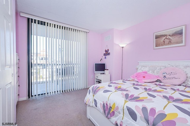 carpeted bedroom featuring access to outside