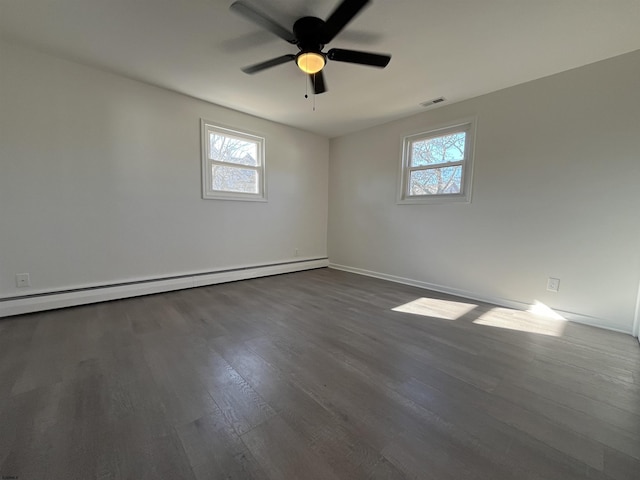 empty room featuring a baseboard radiator, ceiling fan, and dark hardwood / wood-style flooring