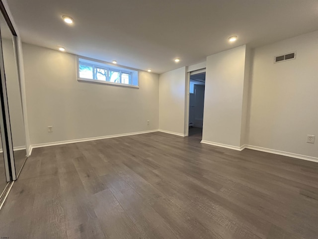 basement featuring dark hardwood / wood-style floors