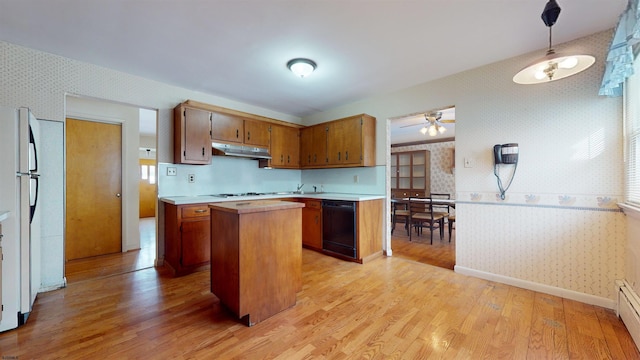 kitchen featuring a kitchen island, dishwasher, fridge, gas cooktop, and light hardwood / wood-style floors