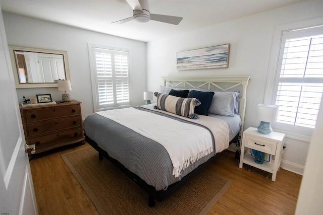 bedroom featuring hardwood / wood-style floors and ceiling fan