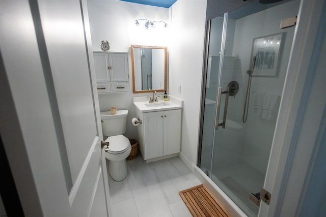 bathroom with vanity, toilet, and walk in shower