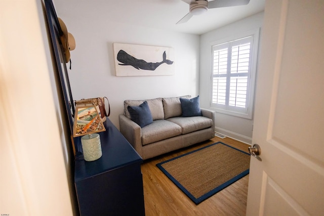 living room with ceiling fan and hardwood / wood-style floors