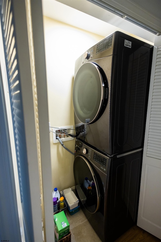 laundry room featuring stacked washer / dryer