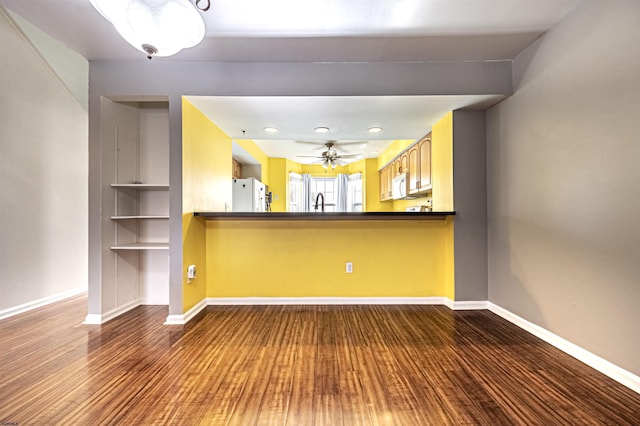 interior space featuring hardwood / wood-style floors and ceiling fan