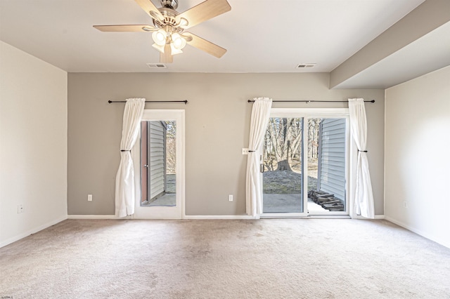 spare room with carpet and ceiling fan