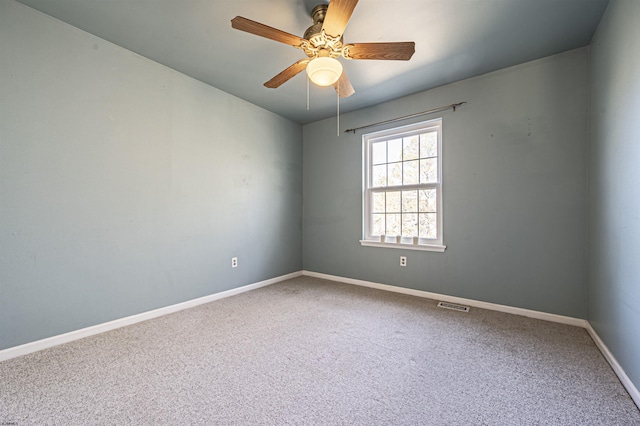 unfurnished room with carpet floors and ceiling fan