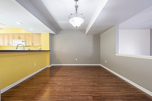 unfurnished dining area featuring dark hardwood / wood-style floors