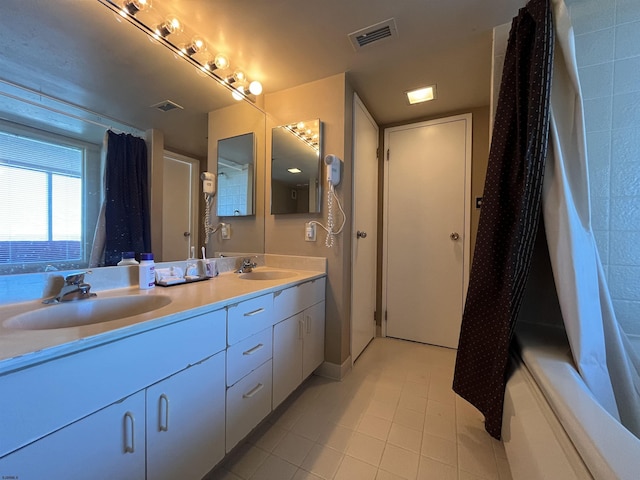 bathroom with vanity and shower / bath combo with shower curtain