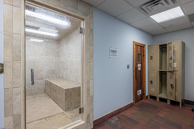 bathroom with a drop ceiling