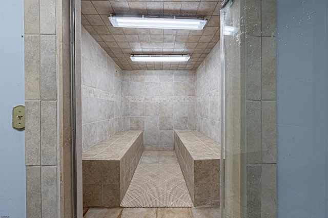 bathroom featuring a tile shower