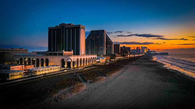 property's view of city featuring a beach view and a water view