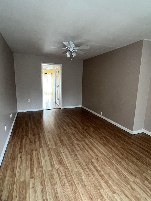 unfurnished room with ceiling fan and light hardwood / wood-style flooring