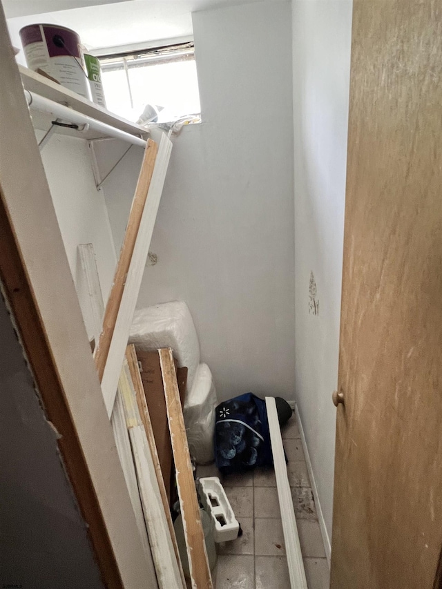 stairway with tile patterned flooring
