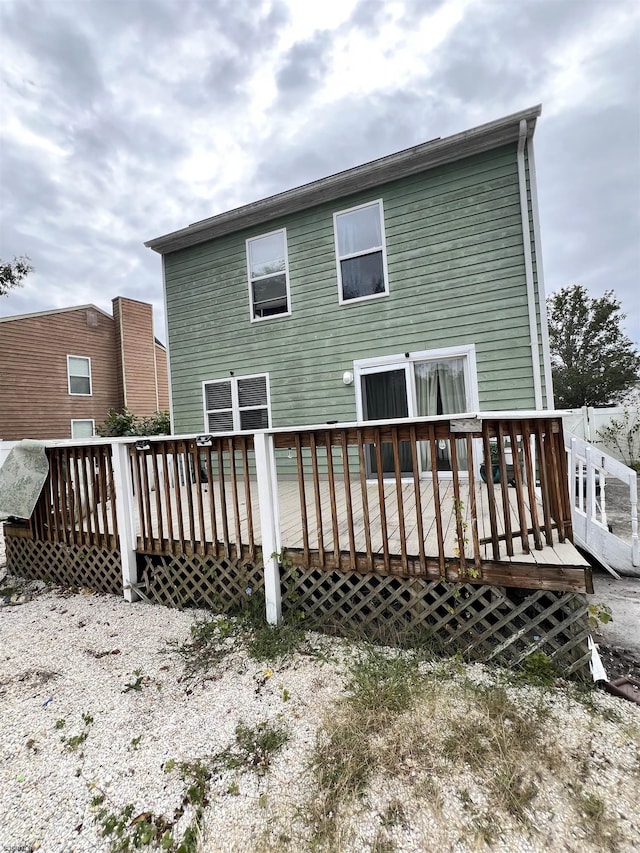 back of property with a deck