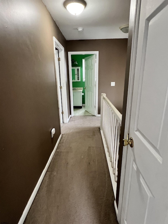 hallway with carpet flooring