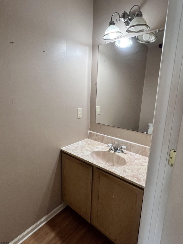 bathroom featuring vanity and hardwood / wood-style floors