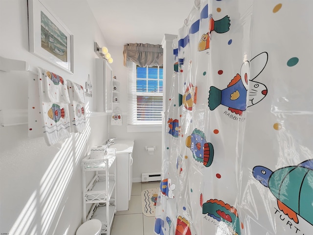 bathroom featuring tile patterned floors, curtained shower, vanity, and a baseboard heating unit