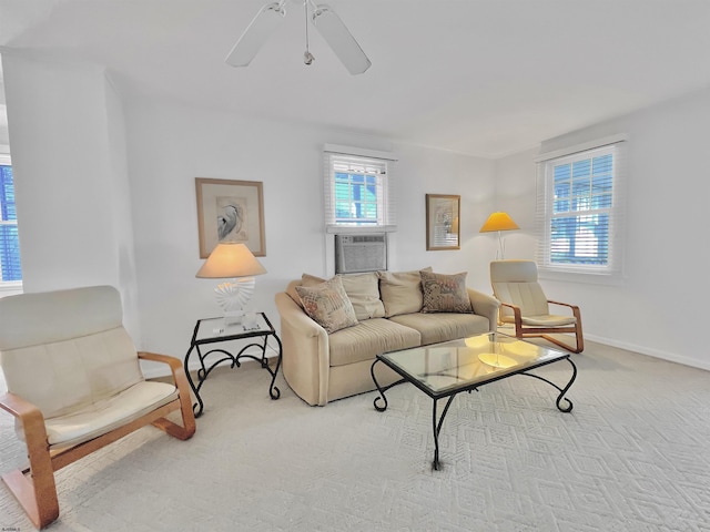 living room with light carpet, ceiling fan, and cooling unit