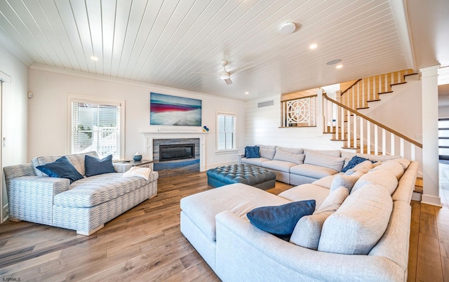 living room featuring wood ceiling, plenty of natural light, and hardwood / wood-style floors